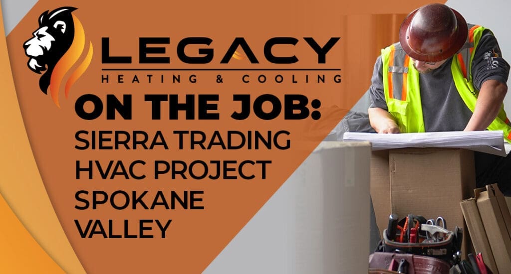 A construction worker reviews blueprints at a worksite, highlighting Legacy Heating & Cooling's Sierra Trading Commercial HVAC project in Spokane Valley.